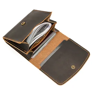 Vintage leather coin card wallet detail showing interior card slots and cash pocket.