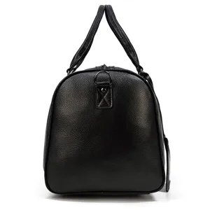 Men leather travel duffel bag side view, black pebble grain business luggage handbag detail.
