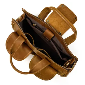 Detail view of men vintage crazy horse leather briefcase with multi pockets and zip compartment.