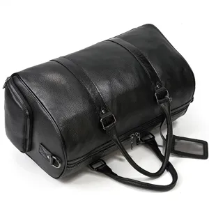 Close-up of black leather duffel bag detail with zipper pocket and metal hardware.