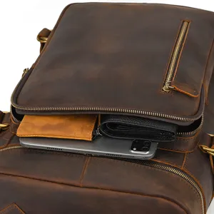 Zaino vintage in vera pelle marrone dettaglio mostra grande capacita multi compartimento.