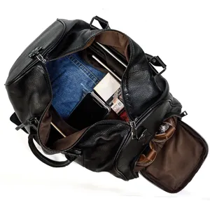 Leather travel duffel bag interior detail, large capacity design with shoe compartment.