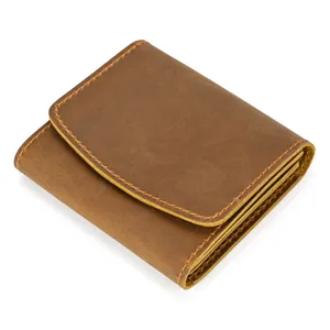 Detail shot of the vintage brown crazy horse leather wallet, showing neat stitching and snap.