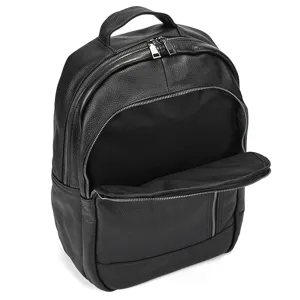 Detailed view of black leather business laptop backpack with metal zippers and handle.