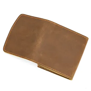 Close-up detail of the brown vintage crazy horse leather coin card wallet and snap pouch.