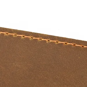 Detailed view of brown crazy horse leather wallet with stitching texture, premium leather craft.