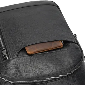 Detailed view of black genuine leather men business backpack, premium cowhide texture and zipper.
