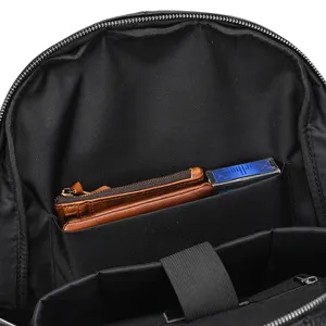 Business laptop backpack interior detail shot, featuring durable black fabric and multi-pocket.