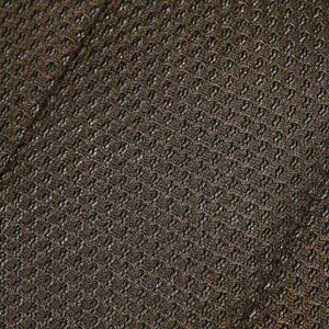Close-up detail view of the breathable brown leather mesh material for men backpack.