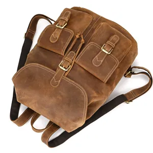 Vintage brown crazy horse leather backpack detail, featuring durable straps and buckles.