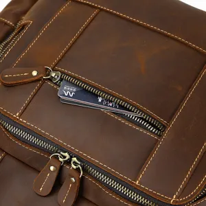 Detail view of vintage men crazy horse leather backpack zipper pocket, premium cowhide travel bag.