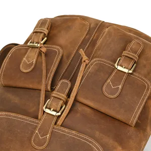 Vintage crazy horse leather backpack detail, premium genuine leather texture with metal buckles.