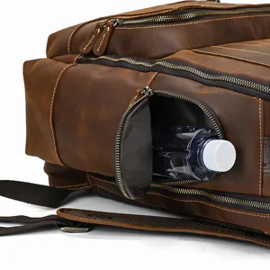 Close-up detail of vintage crazy horse leather men backpack with multiple zip pockets.