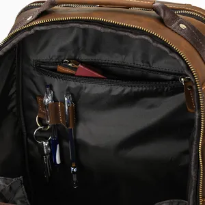 Men vintage leather backpack interior detail, multi-pocket organizer design with pen slots.