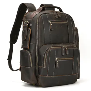Detailed view of the multi-pocket vintage genuine leather backpack showing fine stitching.