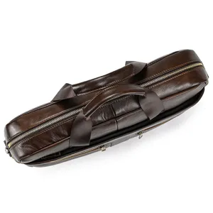 Detailed view of the dark brown leather business briefcase, highlighting premium texture and zippers.