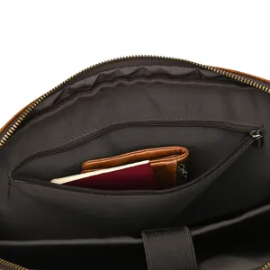 Detailed view of the interior compartment of a vintage crazy horse leather business briefcase.