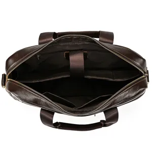 Detailed top view of the brown leather briefcase interior, showing multi-compartment layout.