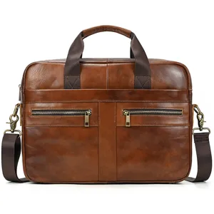 Genuine leather briefcase detail showing premium cowhide texture and metal zippers.
