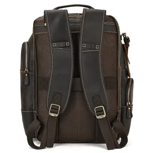 Detailed rear view of the brown leather backpack showing sturdy straps and mesh padding.