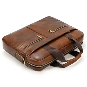 Brown leather men briefcase laptop business bag with dual handles and secure zip pockets.
