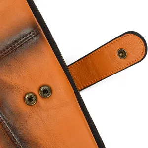Vintage genuine leather long wallet detail view with burnished finish and durable snap button.
