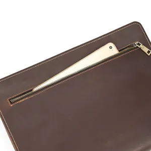 Detailed view of genuine crazy horse leather business document bag with secure zipper pocket.