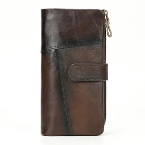 Vintage leather wallet detail, distressed brown cowhide texture, fine stitching and zipper.