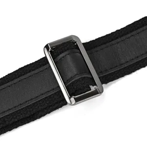 Close-up detail shot of durable black canvas strap with leather accent and metal buckle adjuster.