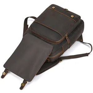 Detailed view of the dark brown genuine leather vintage backpack, showing straps and hardware.