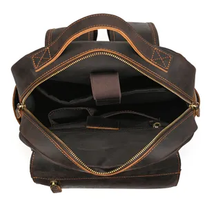 Detailed interior view of a vintage brown crazy horse leather backpack with pockets.
