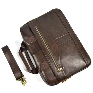 Dark brown leather briefcase detail showing durable zipper, robust handle and strap.