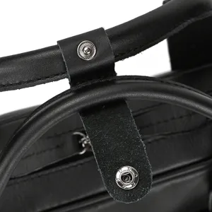 Genuine leather briefcase detail view showing premium handle and hardware for men's business bag.