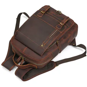 Vintage crazy horse leather men's backpack, detailed view showing durable straps and brass hardware.