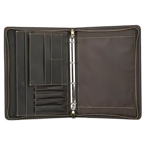 Detailed view of dark brown leather A4 binder portfolio with ring mechanism and slots.