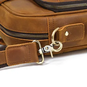 Close-up detail of genuine crazy horse leather men bag, antique bronze hardware and zipper.