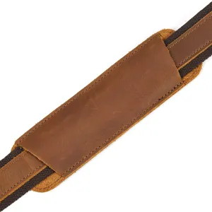 Detail shot of men's crazy horse leather briefcase shoulder strap with durable canvas webbing.