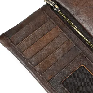 Close-up detail of the vintage brown leather long wallet interior with multi-card slots.