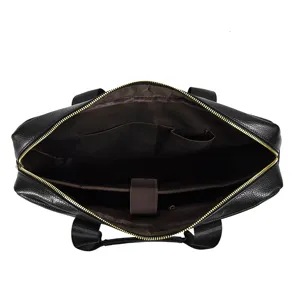 Detailed view of the black leather briefcase interior, showing organized laptop compartments.