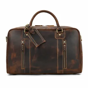 Detalle de bolsa de viaje de cuero genuino vintage, equipaje de negocios de vacuno.