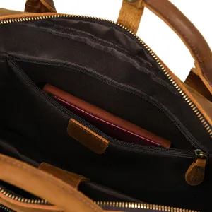 Detailed view of genuine crazy horse leather men briefcase interior with zipper pocket and lining.