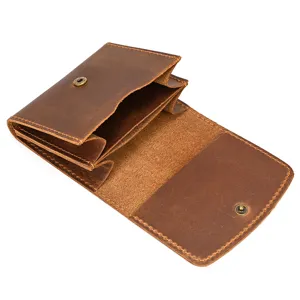 Close-up detailed view of retro brown crazy horse leather coin purse with snap closure.
