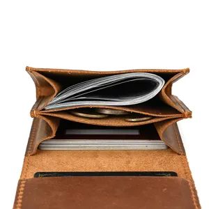 Close-up interior view of brown vintage crazy horse leather wallet with multiple card slots.