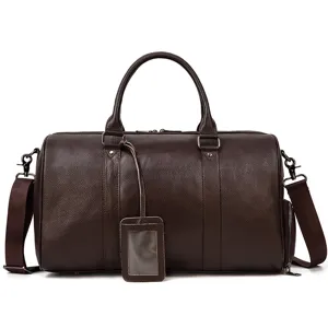 Men's brown leather travel duffel bag with shoulder strap and luggage tag for business trip.