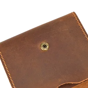 Detailed view of brown crazy horse leather coin pouch card holder with vintage snap button.