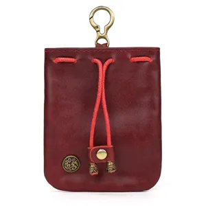 Retro handmade vegetable tanned leather coin purse for women, mini vintage drawstring change bag.