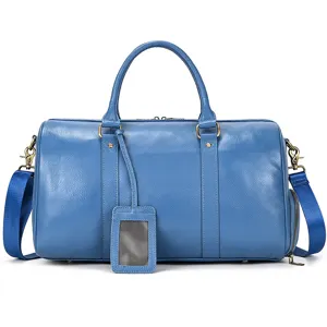 Blue leather travel duffel bag with shoulder strap and luggage tag for men business trip.