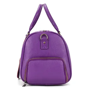 Purple genuine leather travel duffel bag with top handles, front zip pocket and stylish design.