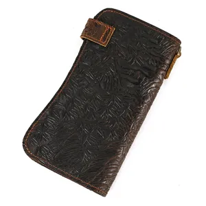 Vintage embossed genuine leather long wallet for men and women, retro design with card slots.