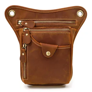 Vintage genuine leather drop leg bag detail showing multi-pocket tactical design and zippers.